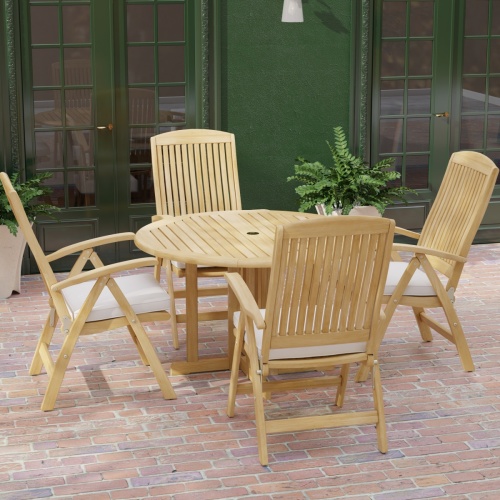  70028 Barbuda Reclining 5 pc Teak Set in angled top view with optional seat cushions on brick patio with house and potted plants in background