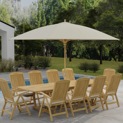  70205 Reclining 11 pc Teak Dining Set with optional umbrella and seat cushions angled side view on patio deck with trees and landscaping plants in background 