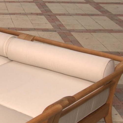 72365MTO Aman Dais 31 inch Corner Bolster Pillow on Aman Dais teak corner frame on paver patio