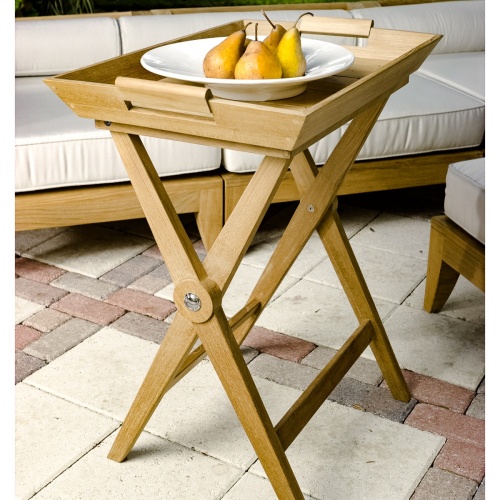 17440 folding teak tray table on stone concrete patio with aman dais sectional in background