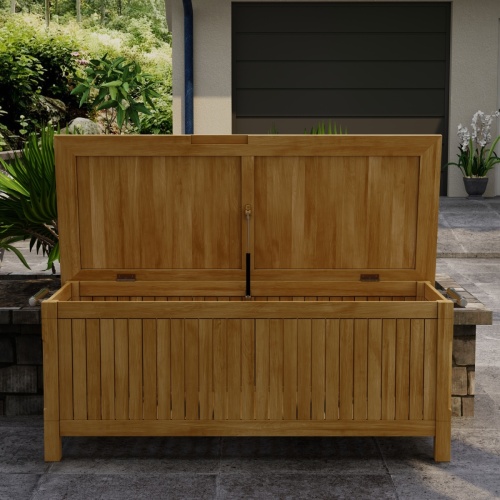 18203 somerset rectangular storage box in front view with open lid on deck with house and landscape plants in background