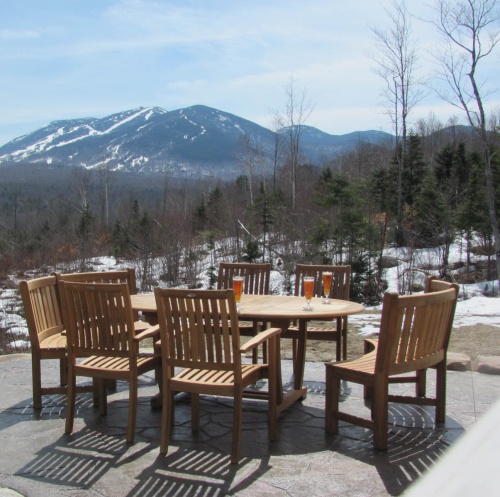 70266 Martinique Sussex 7 Piece Bench Set with 3 beer glasses on table on concrete slab patio overlooking snowy mountains
