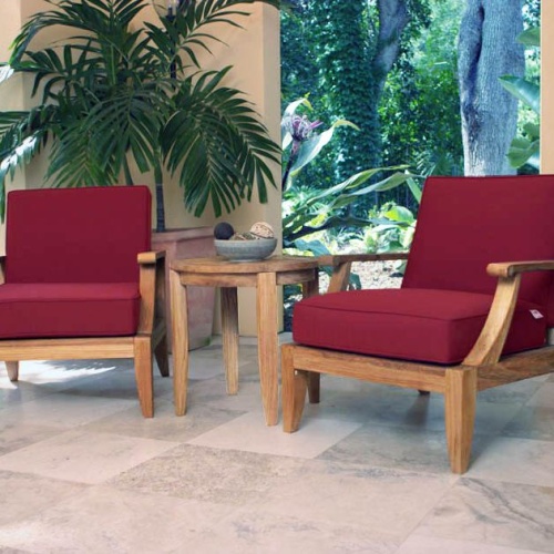70269 Laguna 3 pc Lounge Set cushioned on travertine tiled patio with potted palm tree and landscape plants and trees in background