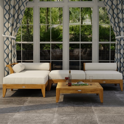 70281 Aman Dais 4 pc Lounge Sofa of 1 corner and 1 end sectional and 2 ottomans in front view on tile patio showing drapes and glass windows in background