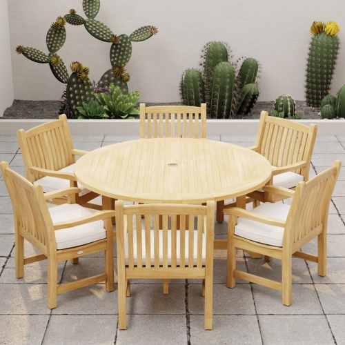 70350 Barbuda Veranda 7 pc Dining Set with optional seat cushions angled aerial view of table top on stone patio with cactus plants against a privacy wall in the background 