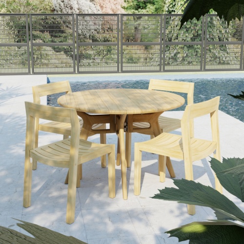 70355 Horizon Surf 5 pc Cafe Dining Set in angled side view on stone patio with pool and fence and landscape trees in the background