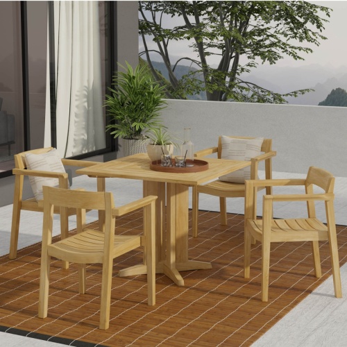 70531 Horizon Pyramid 5 piece Dining Set on patio with potted plant and tray with water carafe and glasses next to glass door overlooking mountains and trees in background