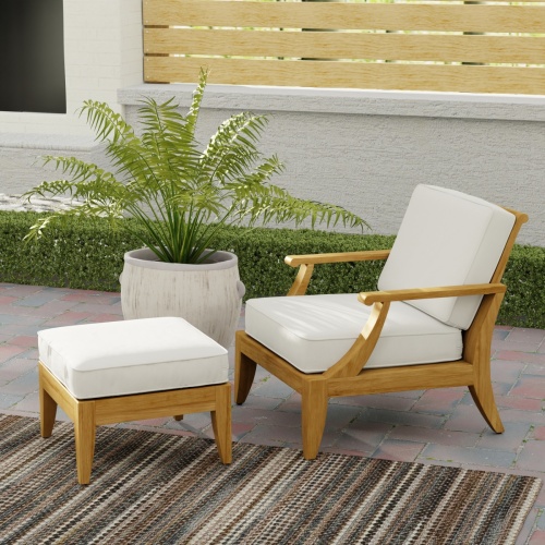 70707 Laguna Chair & Ottoman Set in side angled view on brick paver patio with potted plant and landscaping and privacy wall of house in background