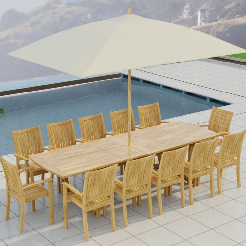 70757 Sussex Veranda 13 pc Teak Dining Set with optional umbrella in aerial end view on patio next to a pool and homes on a hill in background