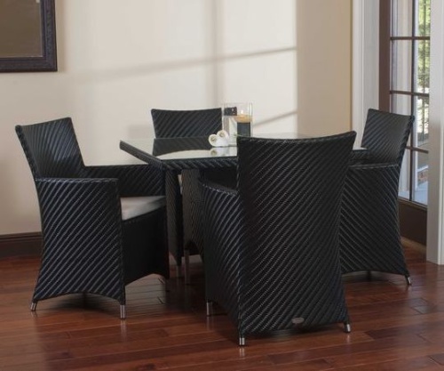 32002BK Valencia 40 inch Square Wicker Table with candle holder on glass table top and 4 Valencia armchairs on wood floors and wall mirror in back and patio door to outside