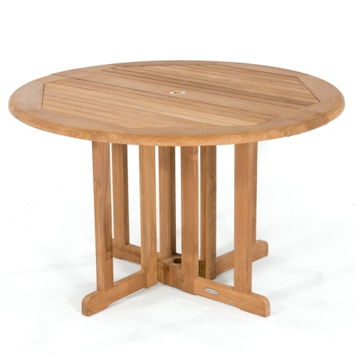 70036 Barbuda teak 5 piece round Dining Set with optional seat cushions and table showing glass bowl of green apples aerial view on brick patio