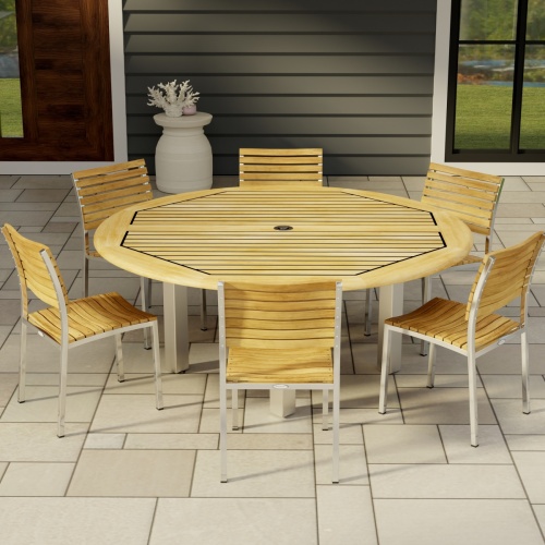 70428 Vogue 7pc Round Dining Set of Vogue Round DIning Table and 6 Vogue Side Chairs in side angled view on tile patio with window and door of house in background 