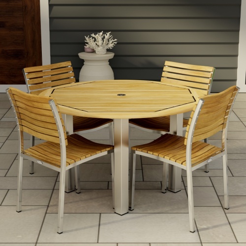 70438 Vogue Dining Set for 4 of Vogue Teak and Stainless Steel 48 inch Round Dining Table and 4 Vogue Stacking Dining Chair angled aerial view on tiled patio