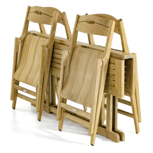 70475 Surf Nevis 5 piece teak rectangular Dining Set with 4 dining chairs completely folded leaning against a folded table on white background
