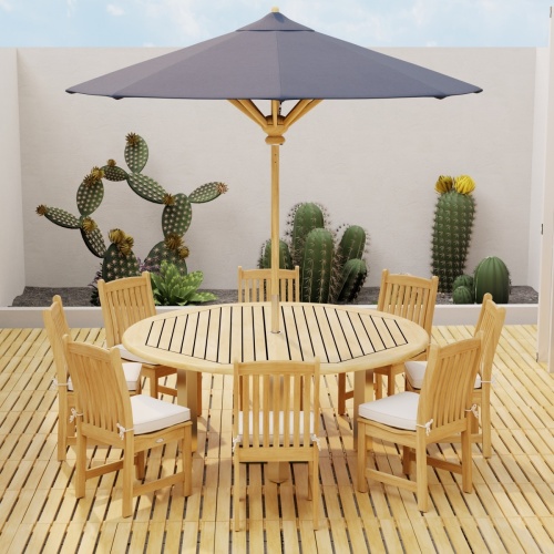 18490 Callebotise Teak Floor Tiles  on an outdoor patio in an angled view with a dining set and optional umbrella and a privacy wall with cactus plants in background 