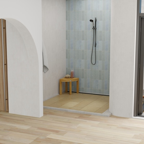 18818 Pacifica Corner Spa Stool in shower showing a loofah and 2 bottles of shampoo on top in a front aerial view of shower and bathroom