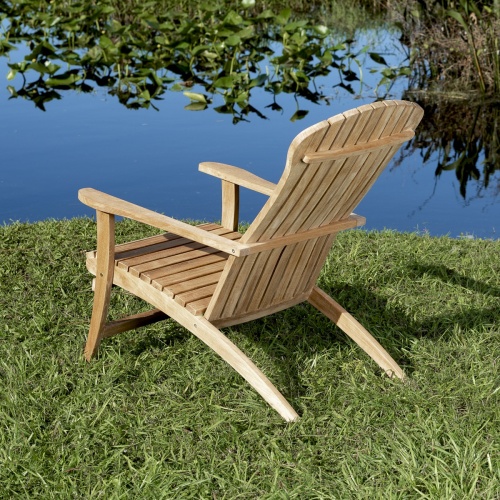 70000 Adirondack Chair angled view of chair back on green grass overlooking a lake 