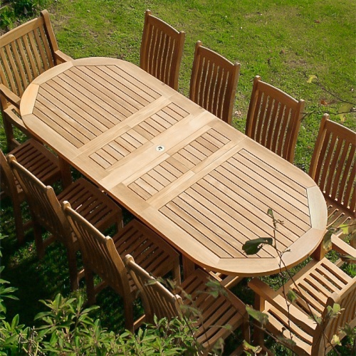 70008 Montserrat Veranda 11 piece teak oval dining set aerial view on a grass field 