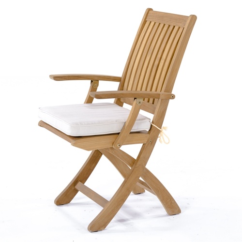 70048 Nevis Barbuda teak Dining Set with optional seat cushions in side view on terrace with glass doors of home in background