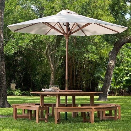 70090 Buckingham Picnic Dining Set with optional seat cushions on outdoor patio with flower vase and tray of coffee and cups with ocean views and plants and trees in background