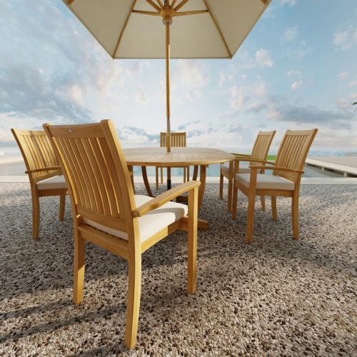  70214 Martinique Sussex Teak 7 pc Dining Set with optional seat cushions and umbrella in side view next to pool with blue sky in background