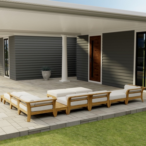 70285 Aman Dais 11 pc L Lounge Set in angled side view on covered tiled patio with potted plant and house in the background