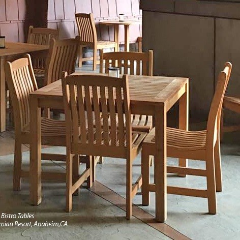 70424 Veranda teak 5 piece square Bistro Set of 4 teak side chairs and 36 inch square dining table on marble floor with other bistro sets in background