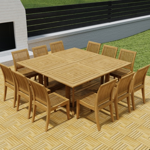 70435  Pyramid 14 pc Teak Dining Set on Teak Parquet floor deck angled aerial view in front of an outdoor fireplace with privacy wall and green lawn in background