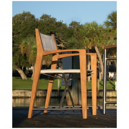 12915RF Refurbished Odyssey Director Chair on boat dock right side view with water and trees in background