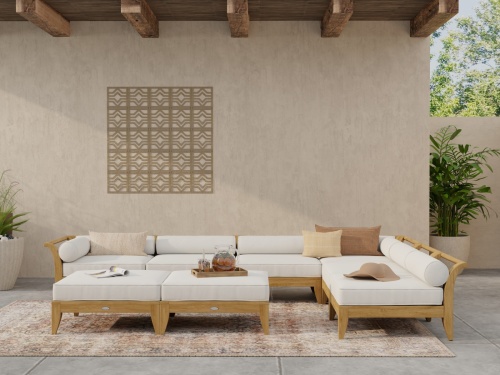 70101 Aman Dais 8 pc Daybed showing 2 corner sectionals and 4 end sectionals and 2 ottomans with cushions angled on wood deck with railing and ocean in background