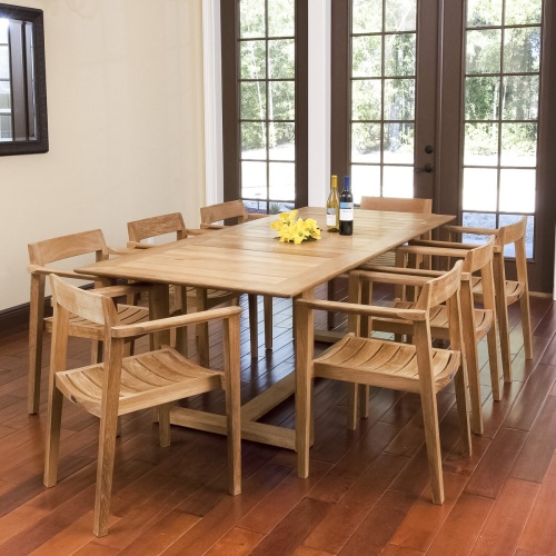 70220 Horizon teak Dining Set with yellow flowers and two wine bottles indoors on wood floors wall mirror and windows with outdoor view 