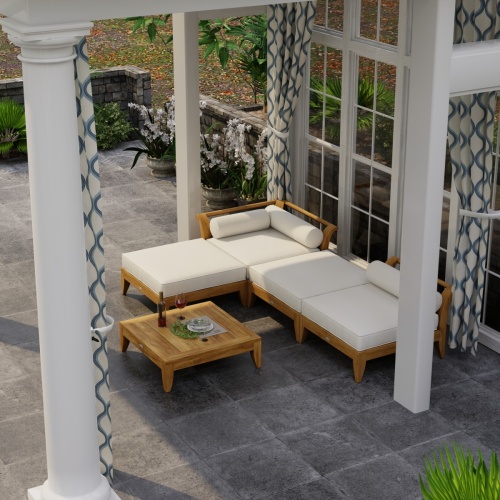 70281 Aman Dais 4 pc Lounge Sofa Set in angled aerial view under a covered pergola with draped glass windows and trees in background 