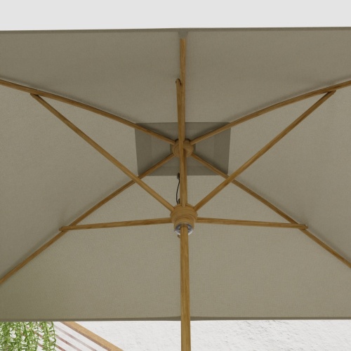 17640F Grand 10 feet Rectangular teak Umbrella with white canvas canopy extended showing closeup of the underside of the umbrella canopy and shaft and stretchers 