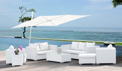 SP25100SET Spectra Solo Umbrella and Paver Base on terrace over deep seating set with pool grass area ocean and blue sky in background