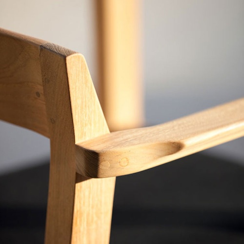 12901 Horizon Teak Dining Armchair showing closeup of right side arm and chair back view