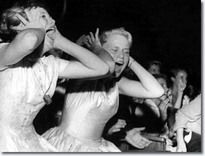 Teenage fans scream during Elvis' appearance at the Florida Theatre.